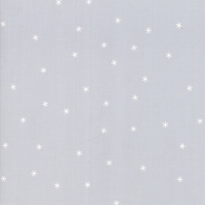 The image shows a light gray background with white asterisk-like stars scattered throughout.