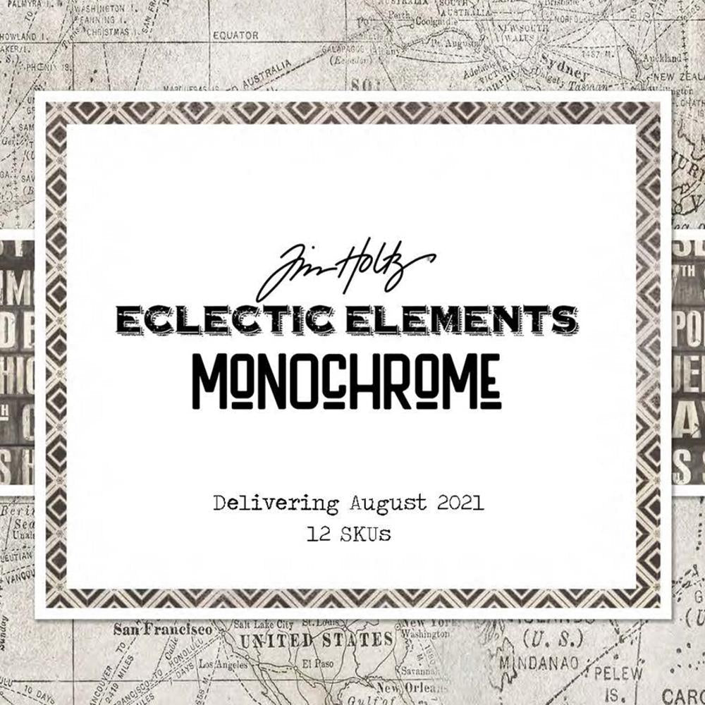 The background is one of Tim Holtz’s grayscale map prints. In front is a white square with grayscale, tribal-inspired polygons on the edges. In the middle of the white square is the text “Tim Holtz; Eclectic Elements Monochrome.”