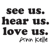 The image has the text “see us. hear us. love us.” in a bold serif font, centered, with each phrase on a different line. The text “Ann Kelle” is in a handwritten-style font below the first three lines, justified to the right.