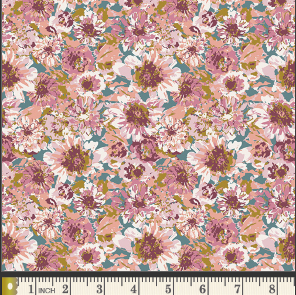A close-up of a floral fabric pattern with pink, mauve, white, and olive green flowers on a muted teal background, with a 1-inch fabric ruler visible along the bottom edge.