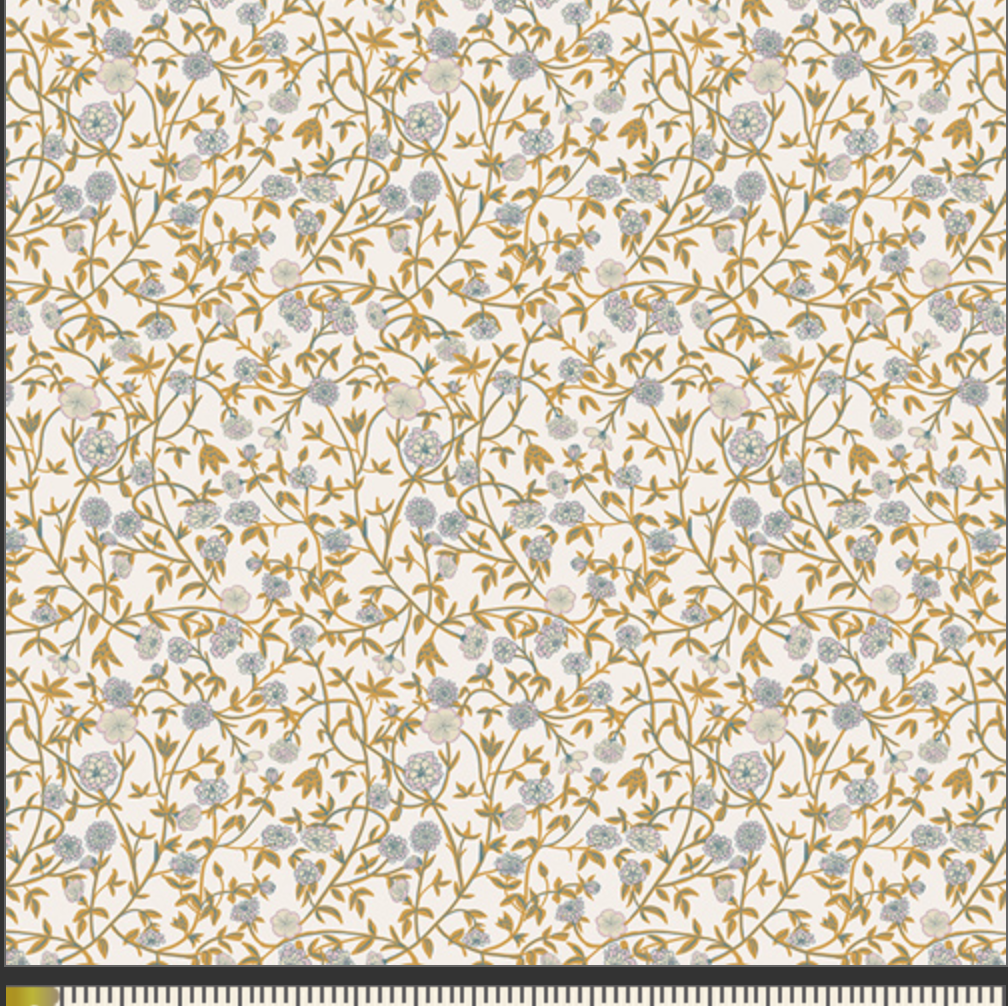 A close-up of a fabric
pattern with a dense floral vine design in muted blue-gray and mustard-gold on a warm off-white background, with a measurement ruler along the bottom edge.
