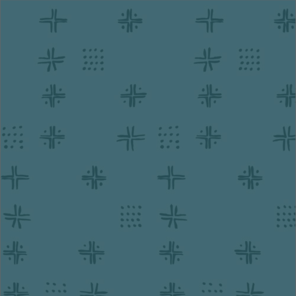 A close-up of a teal fabric pattern featuring repeating dark teal geometric motifs, with a cream-colored fabric ruler visible along the bottom edge for scale.
