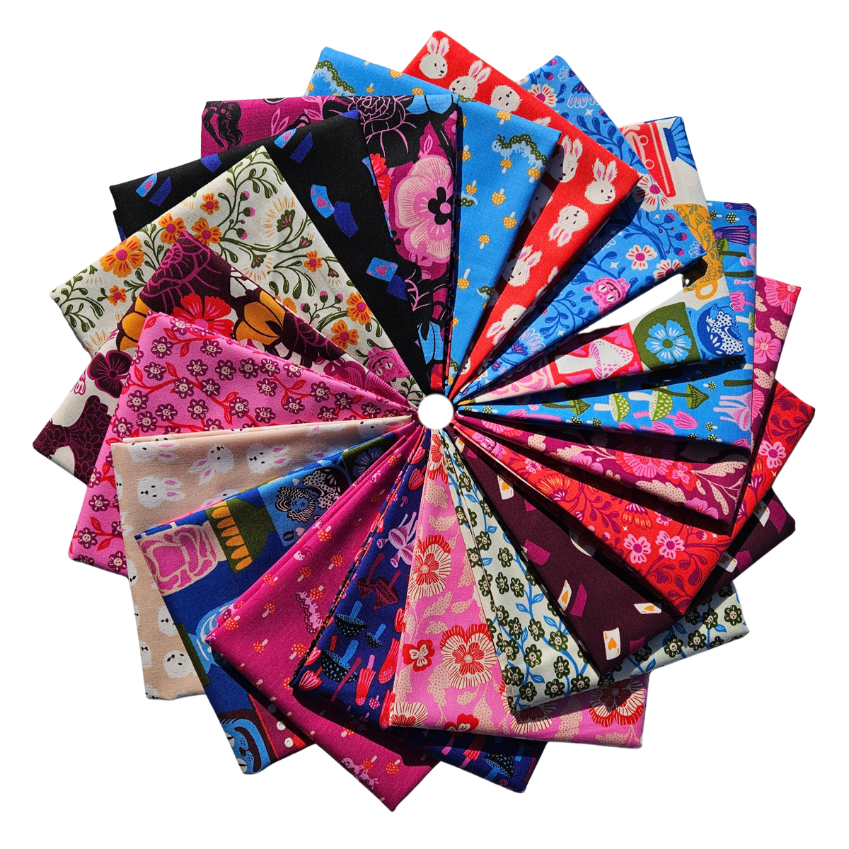 A collection of colorful patterned fabric squares arranged in a circular fan shape on a plain white background.