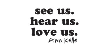 The image has the text “see us. hear us. love us.” in a bold serif font, centered, with each phrase on a different line. The text “Ann Kelle” is in a handwritten-style font below the first three lines, justified to the right.
