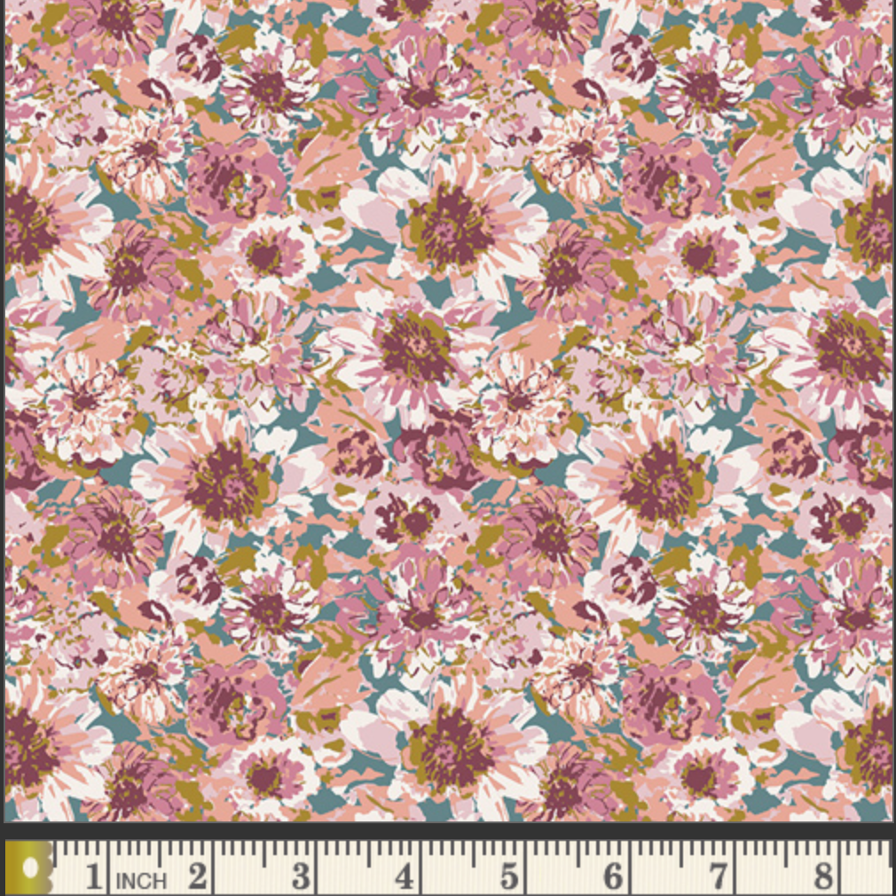 A close-up of a floral fabric pattern with pink, mauve, white, and olive green flowers on a muted teal background, with a 1-inch fabric ruler visible along the bottom edge.