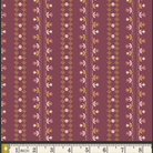 A close-up of a fabric pattern featuring vertical stripes with small floral and geometric motifs in pink, white, mustard yellow, and olive green on a dusty burgundy background. A measuring ruler is visible along the bottom edge to indicate scale.