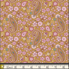 A close-up of a floral and paisley patterned fabric sample on a mustard yellow background, with pink flowers, pink and blue paisley motifs, and a white inch ruler along the bottom edge for scale.