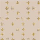 Beige fabric with a repeating pattern of mustard yellow geometric symbols, including crosses, stars, and dotted clusters, shown with a ruler at the bottom for scale.