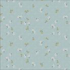 A fabric pattern swatch showing a light blue-green background with a small-scale floral print in white, yellow, and green, with a measuring ruler along the bottom edge.