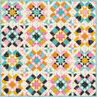 A colorful geometric quilt pattern featuring repeating star and diamond blocks in pink, teal, mustard yellow, orange, black, and cream.