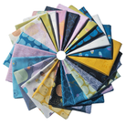 Collection of colorful fabric swatches arranged in a circular pattern on a white background