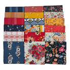 Collection of colorful fabric swatches with various floral patterns on a white background