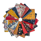 Collection of colorful fabric squares arranged in a circular pattern on a white background