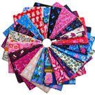 Assorted colorful fabric swatches arranged in a circular pattern on a white background