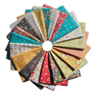 Circular arrangement of colorful fabric swatches with various patterns on a white background