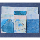 Set of fabric swatches with blue and green patterns on a blue background