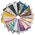 A circular fan arrangement of multiple fabric swatches with assorted patterns including botanical prints, vintage maps, script, florals, and text designs on a plain white background.