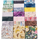 A 3x7 grid of folded fabric samples showing a variety of patterns and colors, including botanical prints, vintage text, stripes, butterflies, and floral designs.