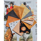 A fan arrangement of Halloween-themed fabric swatches, including orange pumpkins, black and white gingham, orange plaid, black gingham, and orange-and-white stripes, displayed over a fabric Panel in the background.