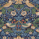 Enlarged detail of a decorative pattern with birds and flowers on a dark blue background.