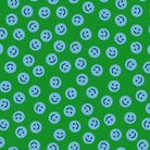 Pattern of blue smiley faces on a green background