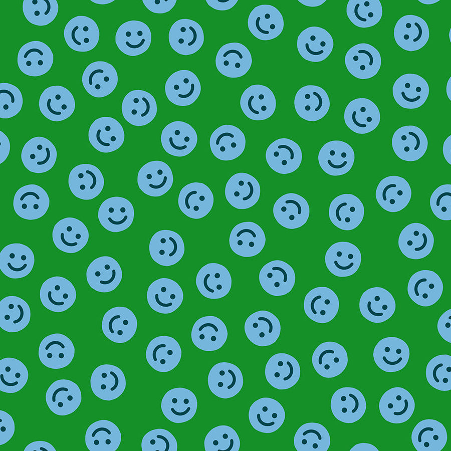 Pattern of blue smiley faces on a green background